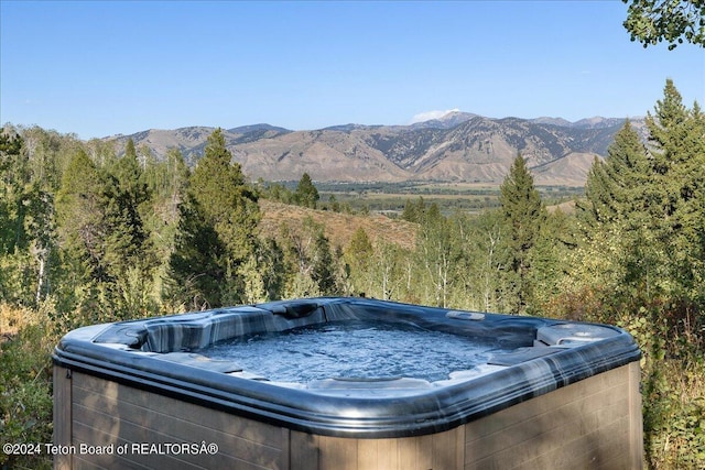 property view of mountains featuring a wooded view