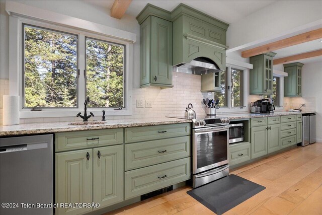 3705 W Mccollister Dr, Teton Village, WY 83025 - kitchen featuring light wood-style flooring, a sink, beam ceiling, green cabinetry, and appliances with stainless steel finishes