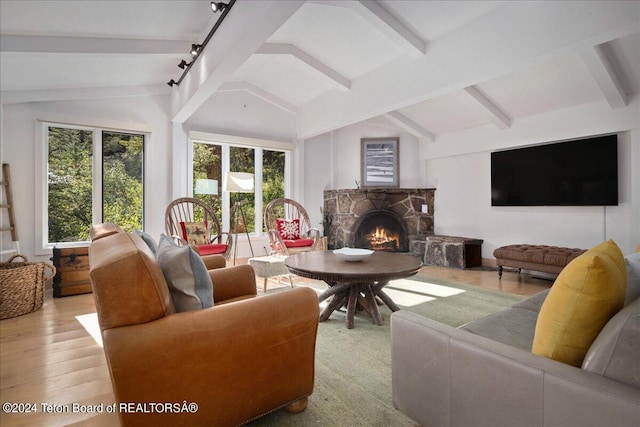 3705 W Mccollister Dr, Teton Village, WY 83025 - living room with vaulted ceiling with beams, a fireplace, and wood finished floors
