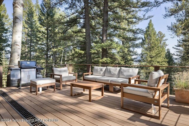 3705 W Mccollister Dr, Teton Village, WY 83025 - wooden deck with outdoor lounge area