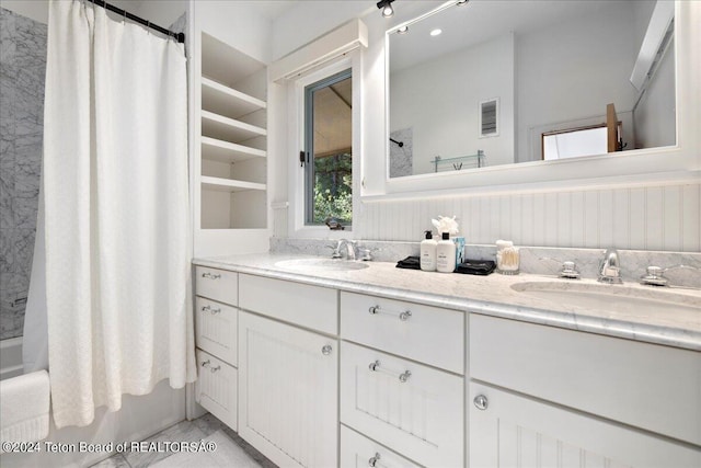 3705 W Mccollister Dr, Teton Village, WY 83025 - full bath featuring double vanity, visible vents, a sink, and shower / bath combo with shower curtain