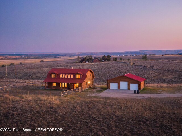 aerial view at dusk with a rural view