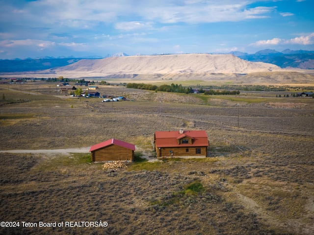 mountain view featuring a rural view