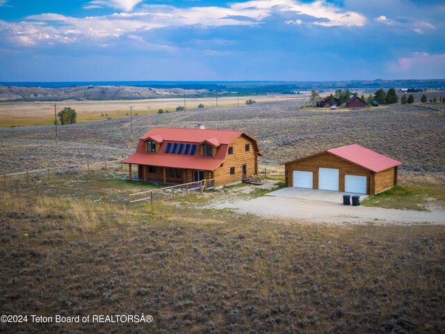 birds eye view of property featuring a rural view