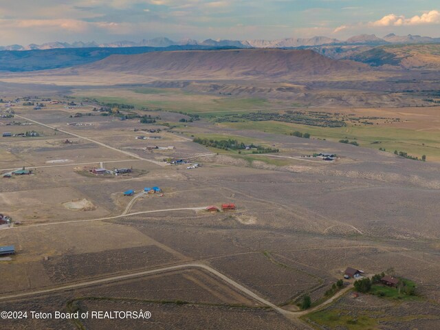 aerial view with a mountain view and a rural view