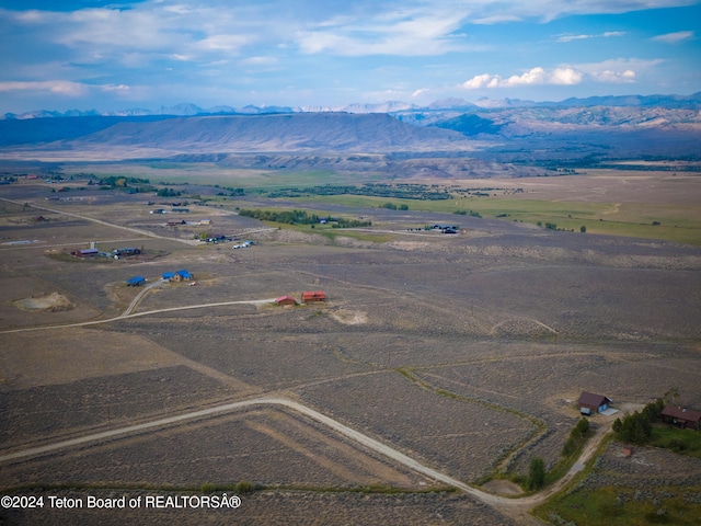 aerial view with a mountain view and a rural view