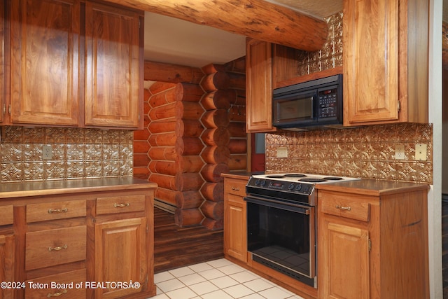 kitchen with light tile patterned flooring, black microwave, range with electric stovetop, tasteful backsplash, and rustic walls