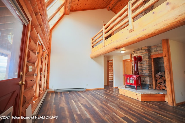 unfurnished living room featuring dark hardwood / wood-style flooring, a baseboard radiator, a wood stove, and vaulted ceiling with beams