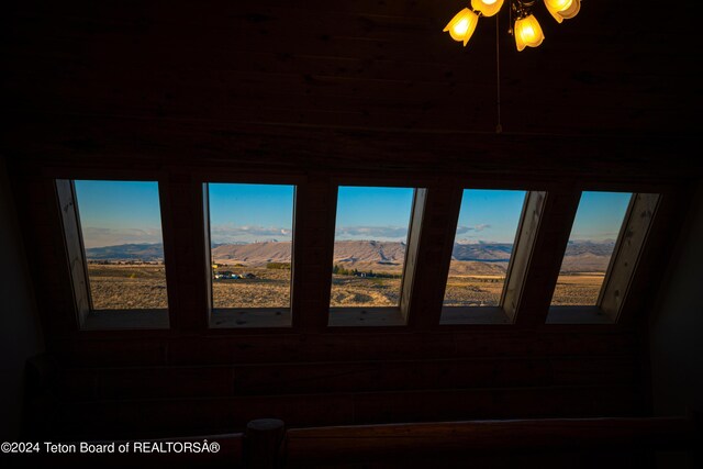 details featuring ceiling fan and a mountain view