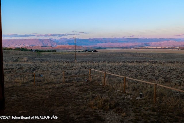 mountain view featuring a rural view