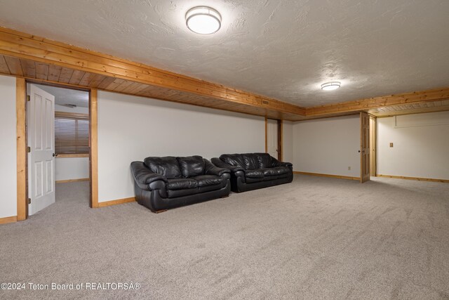 living room featuring a textured ceiling and carpet flooring