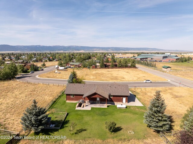 birds eye view of property featuring a mountain view