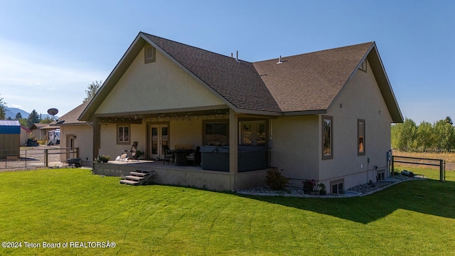 rear view of property featuring an outdoor hangout area, a yard, and a patio