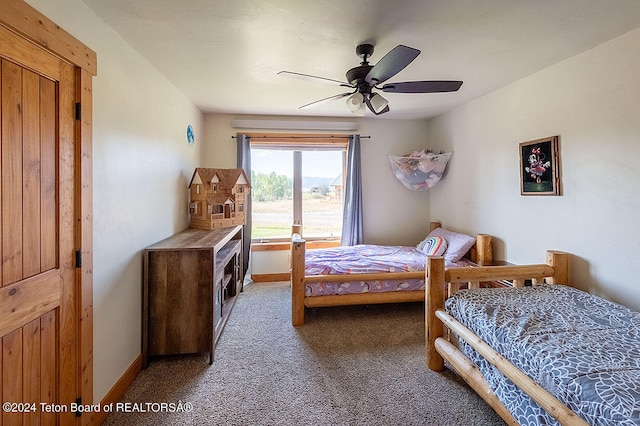 carpeted bedroom featuring ceiling fan