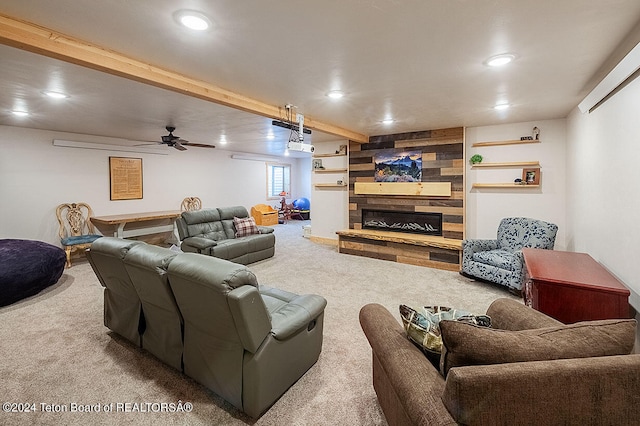 carpeted living room featuring ceiling fan and a large fireplace