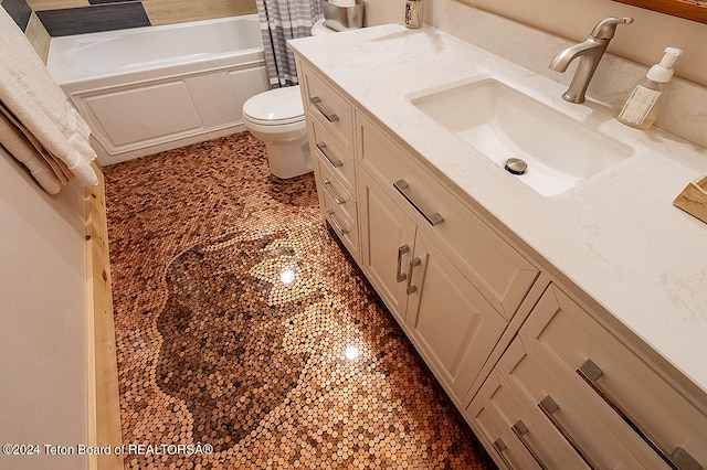 bathroom with a tub to relax in, vanity, and toilet