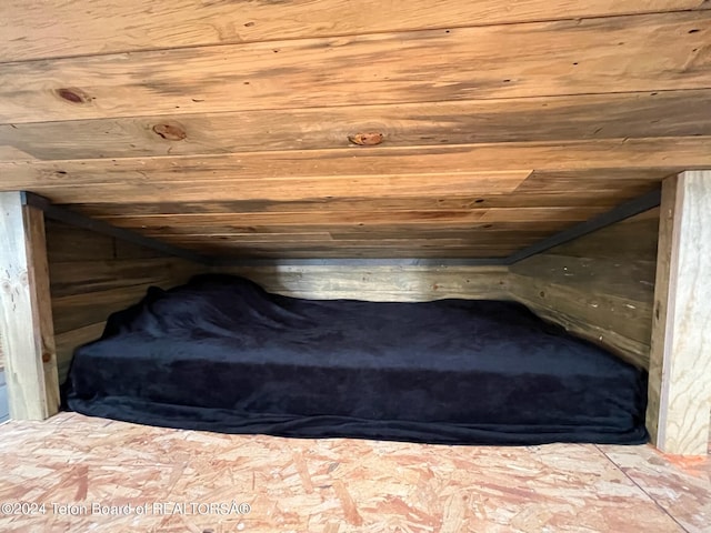 unfurnished bedroom with lofted ceiling and wood ceiling