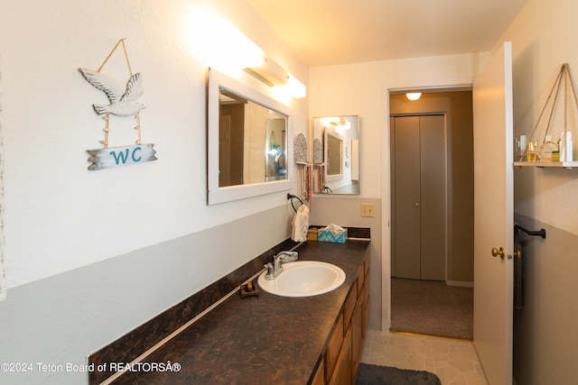 bathroom featuring tile patterned floors and vanity