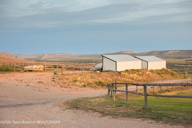 property view of mountains featuring a rural view