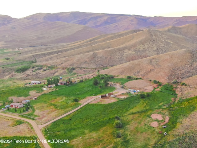 aerial view featuring a mountain view and a rural view