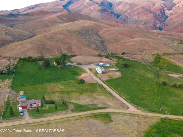 drone / aerial view featuring a mountain view and a rural view