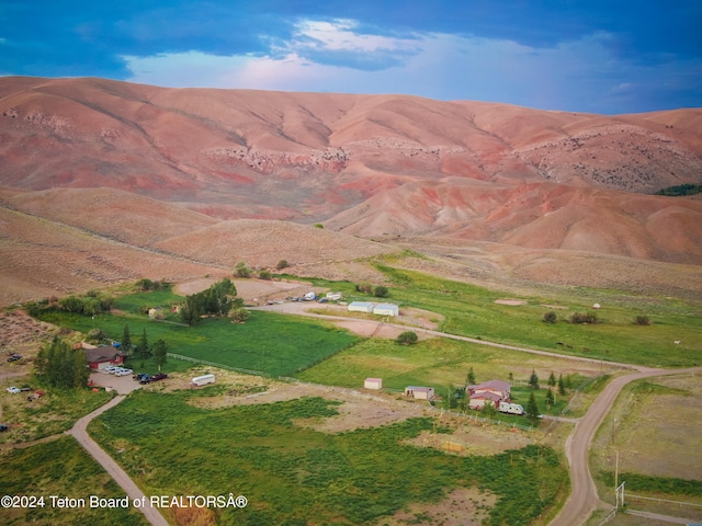 mountain view featuring a rural view