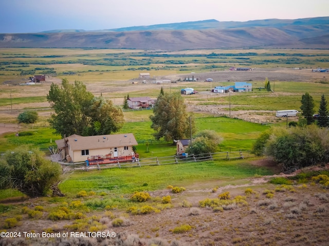 bird's eye view with a mountain view and a rural view