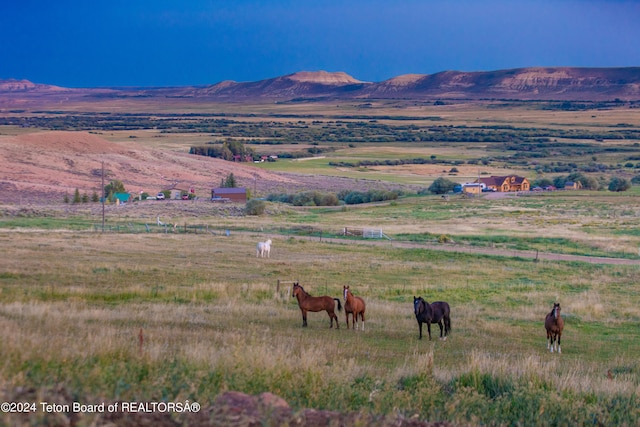 mountain view featuring a rural view