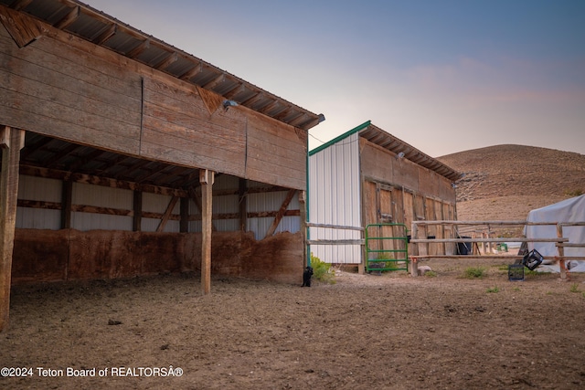 view of horse barn with a mountain view