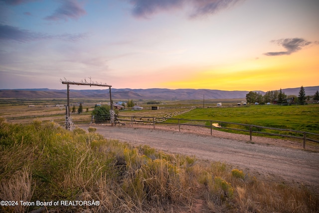 property view of mountains featuring a rural view