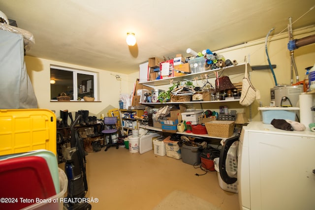 storage area featuring washer / dryer and water heater