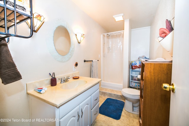 bathroom featuring vanity, toilet, walk in shower, and tile patterned flooring