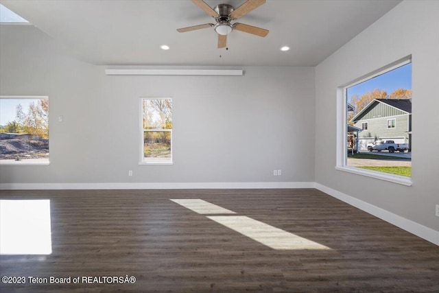 spare room featuring ceiling fan and dark hardwood / wood-style floors