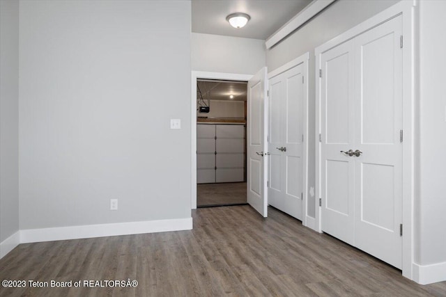 unfurnished bedroom with light wood-type flooring