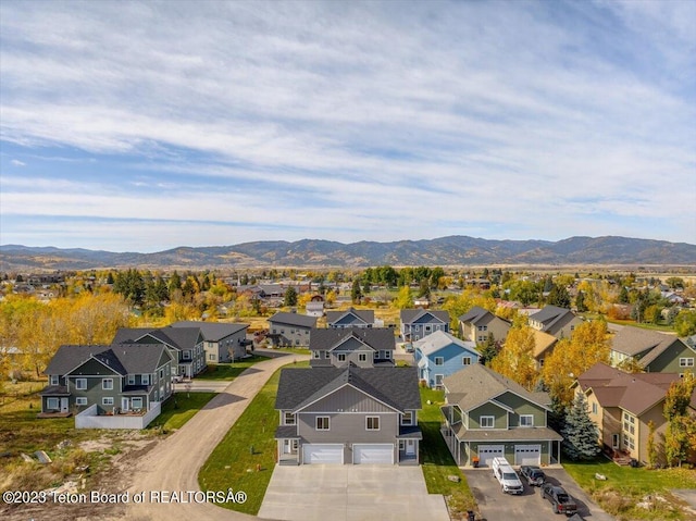 birds eye view of property with a mountain view