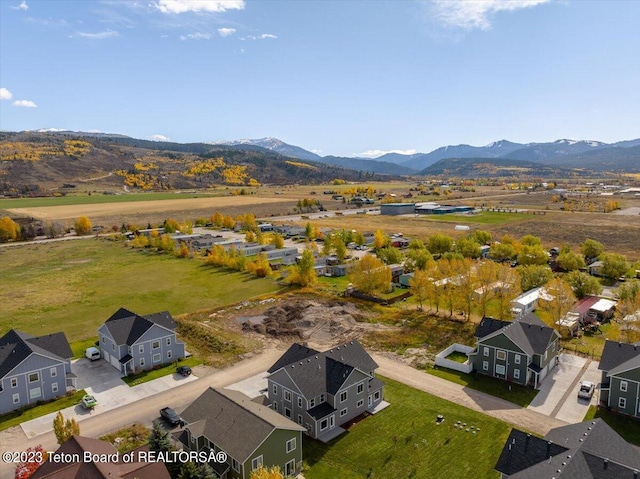 birds eye view of property with a mountain view