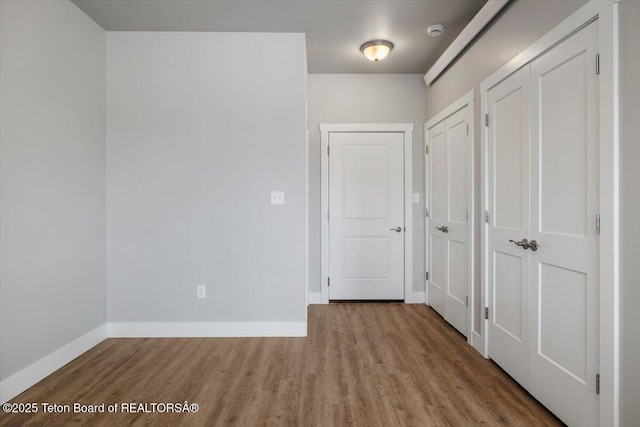 interior space featuring multiple closets and light wood-type flooring