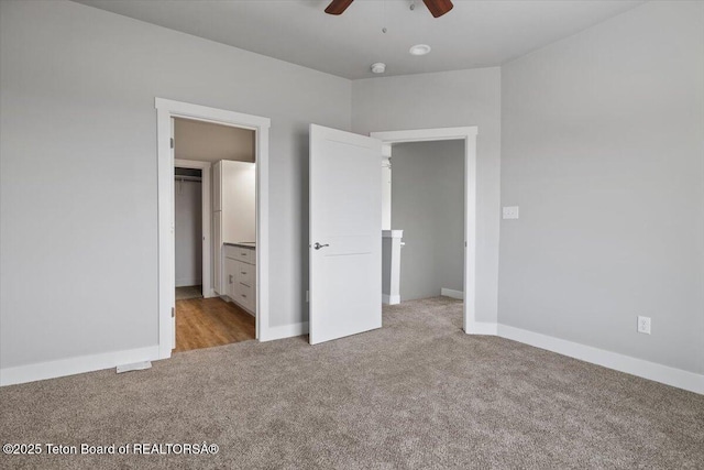 unfurnished bedroom featuring light carpet and ceiling fan