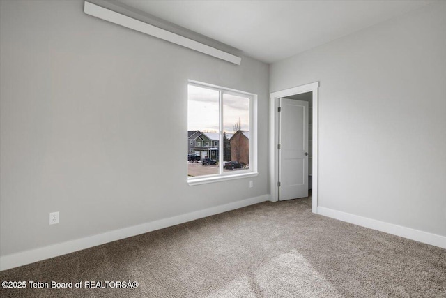 empty room with carpet flooring