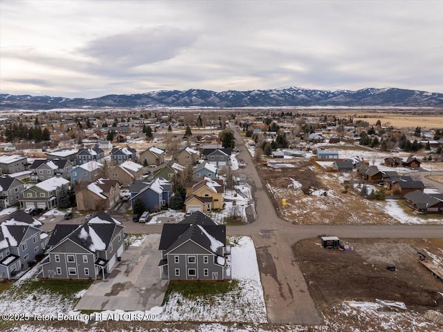 birds eye view of property featuring a mountain view