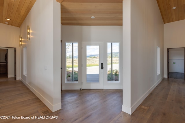 entryway featuring wood-type flooring, wood ceiling, french doors, and high vaulted ceiling