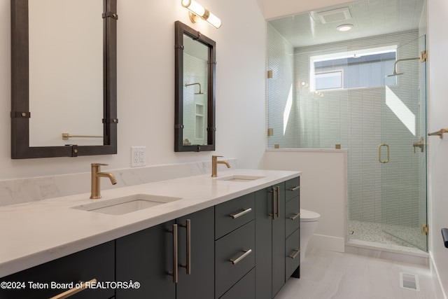 3176 Slinger Ct, Driggs, ID 83422 - full bathroom with double vanity, toilet, and a stall shower