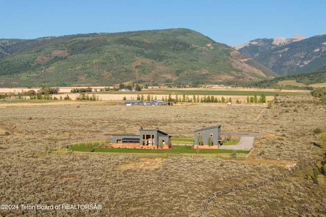 view of mountain feature with a rural view