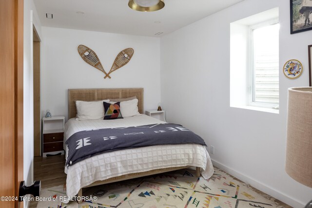 bedroom featuring hardwood / wood-style flooring