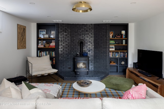 living room featuring a wood stove