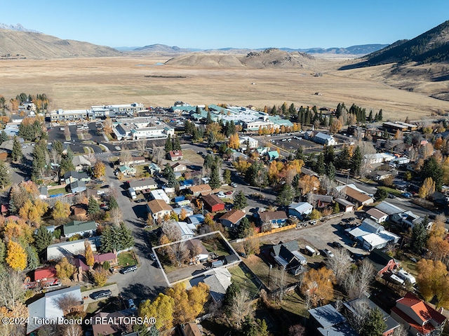 drone / aerial view featuring a mountain view