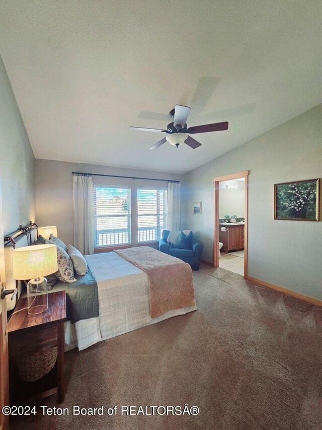 bedroom with ceiling fan, ensuite bathroom, and carpet