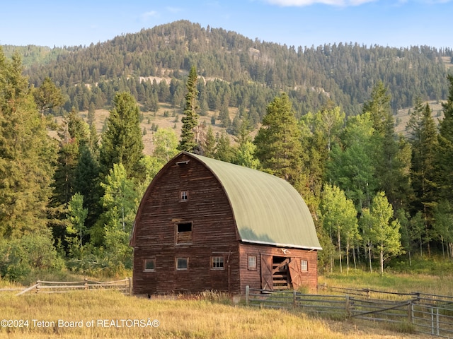 view of outbuilding with a mountain view