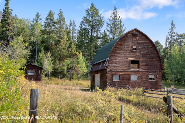 view of property exterior featuring an outbuilding