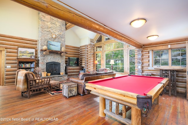 rec room with hardwood / wood-style flooring, a stone fireplace, billiards, and a wealth of natural light